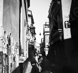 Une rue commerante du vieux Sville.  - Espagne (Madrid)  - 1902